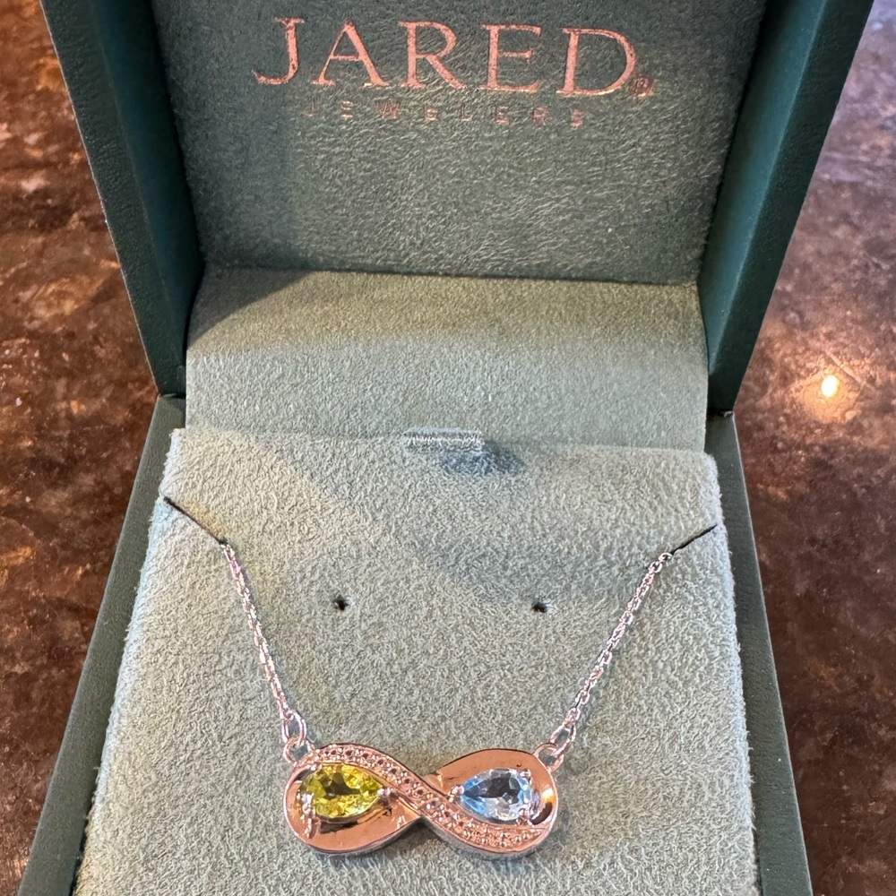 Genuine silver infinity necklace with white sapphires, perdot and blue topaz